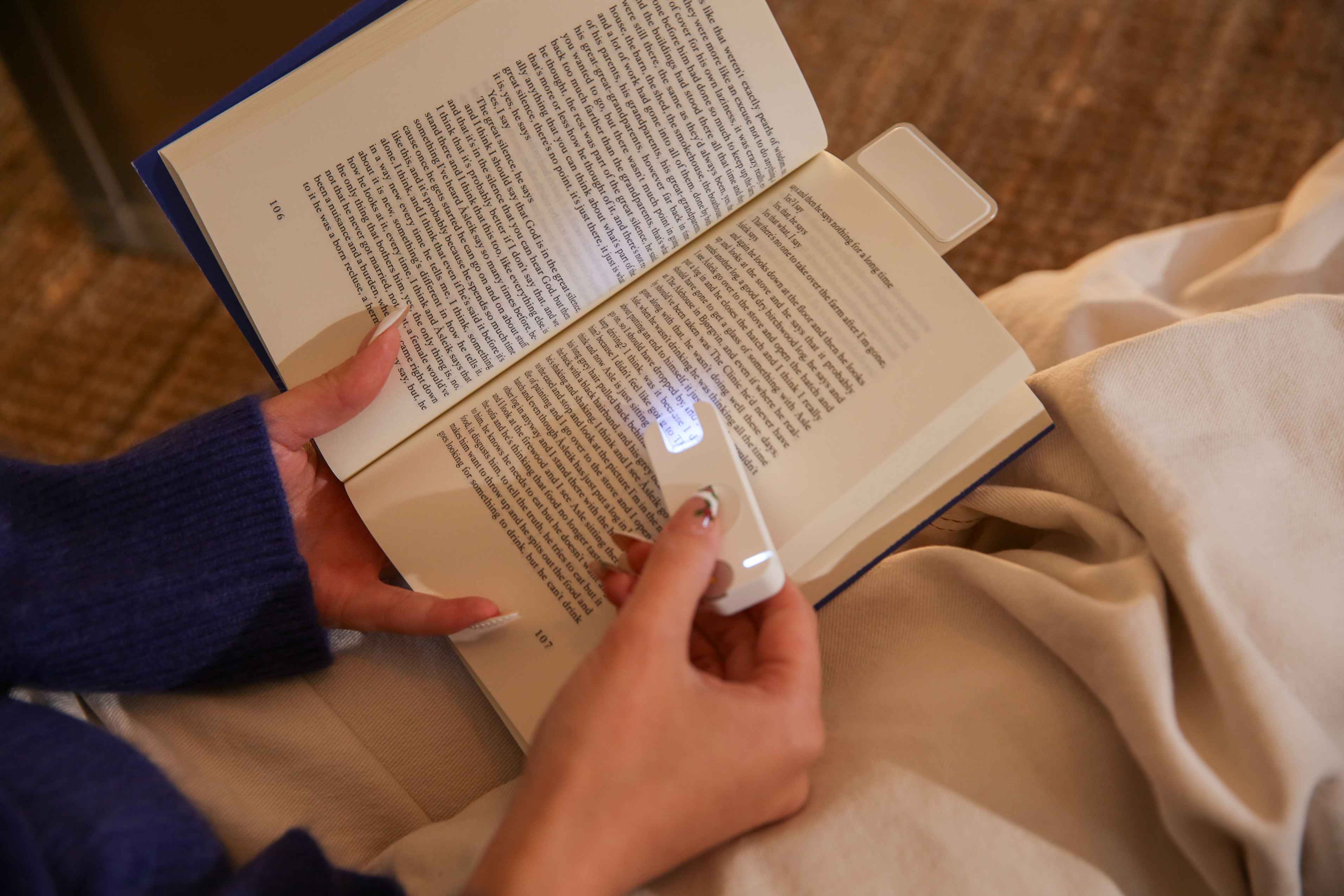 Mark device scanning highlighted text on a physical book page with scanner light visible